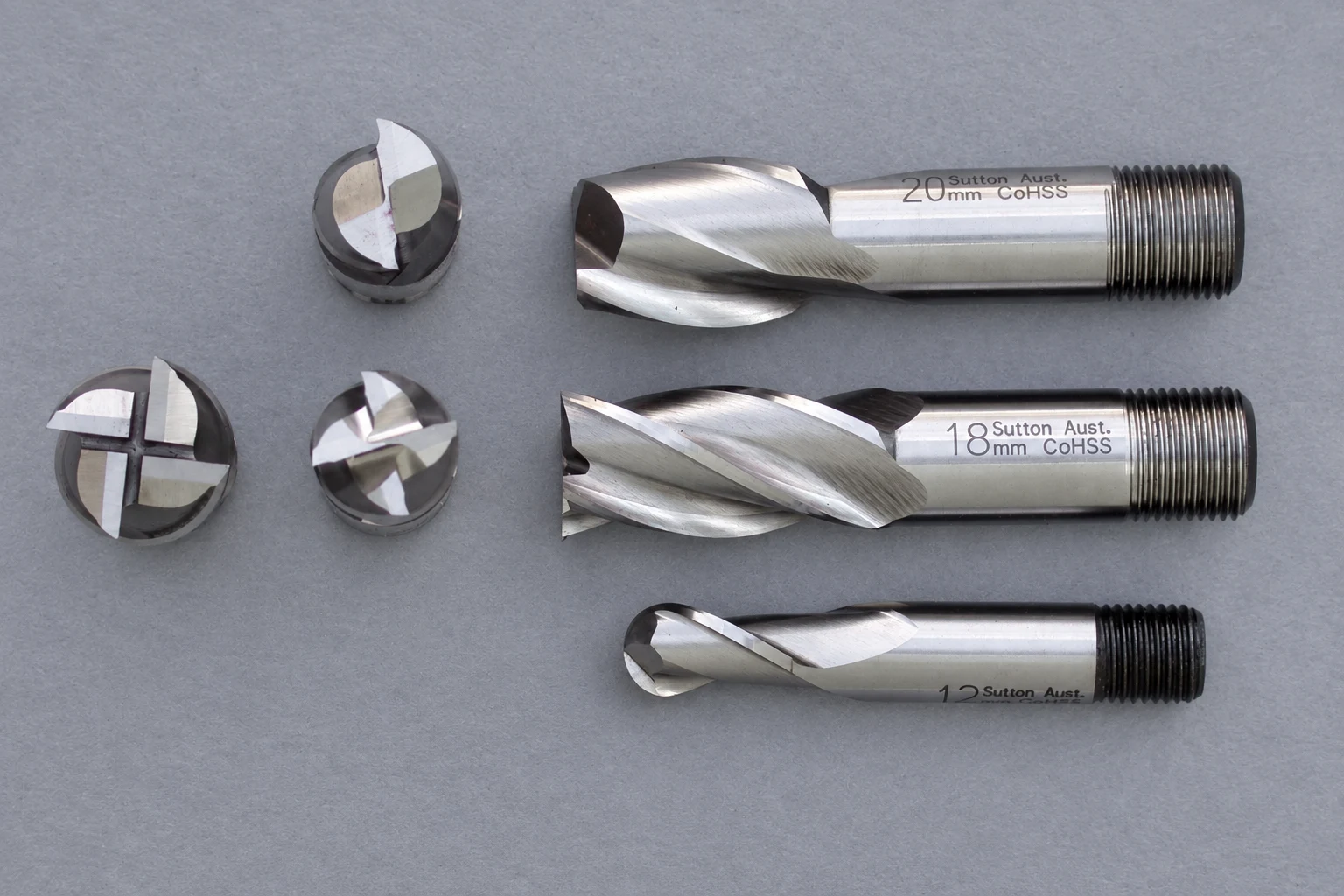 Photographed end mills and their cutting end examples; photo-based editorial edit