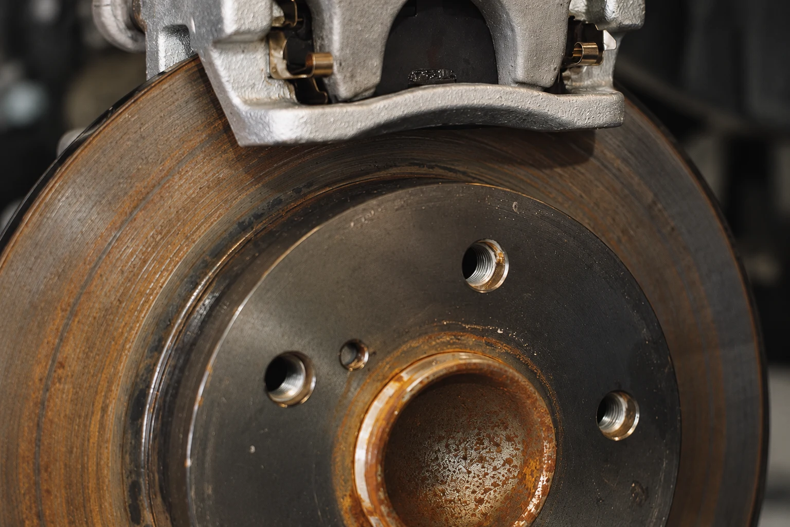 Photo-based close-up of an automotive brake rotor surface and hub